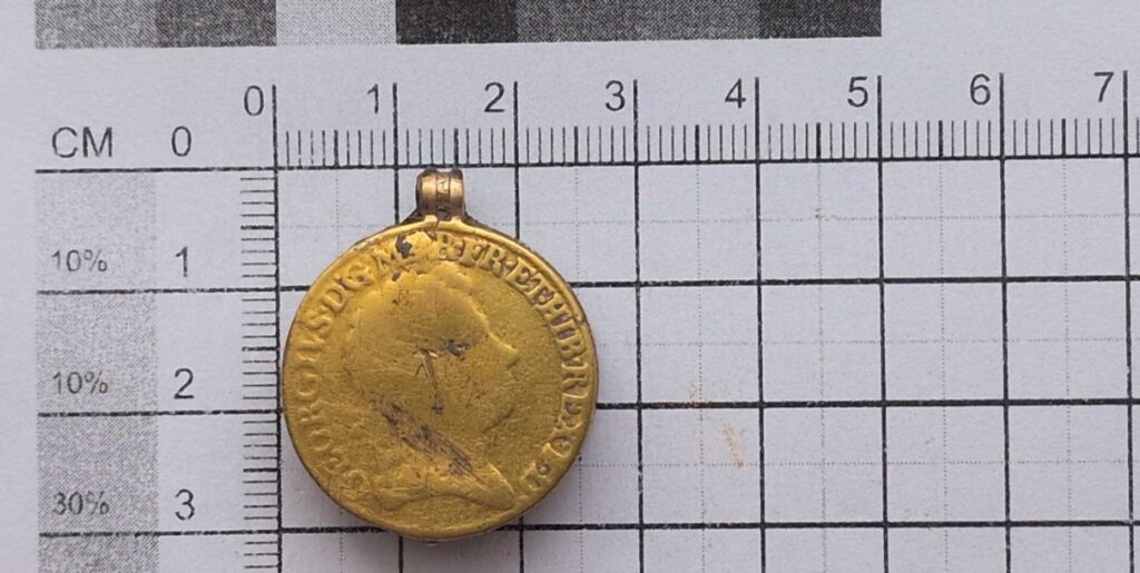 George I gold guinea coin swivel fob/seal locket and an engraved bloodstone intaglio